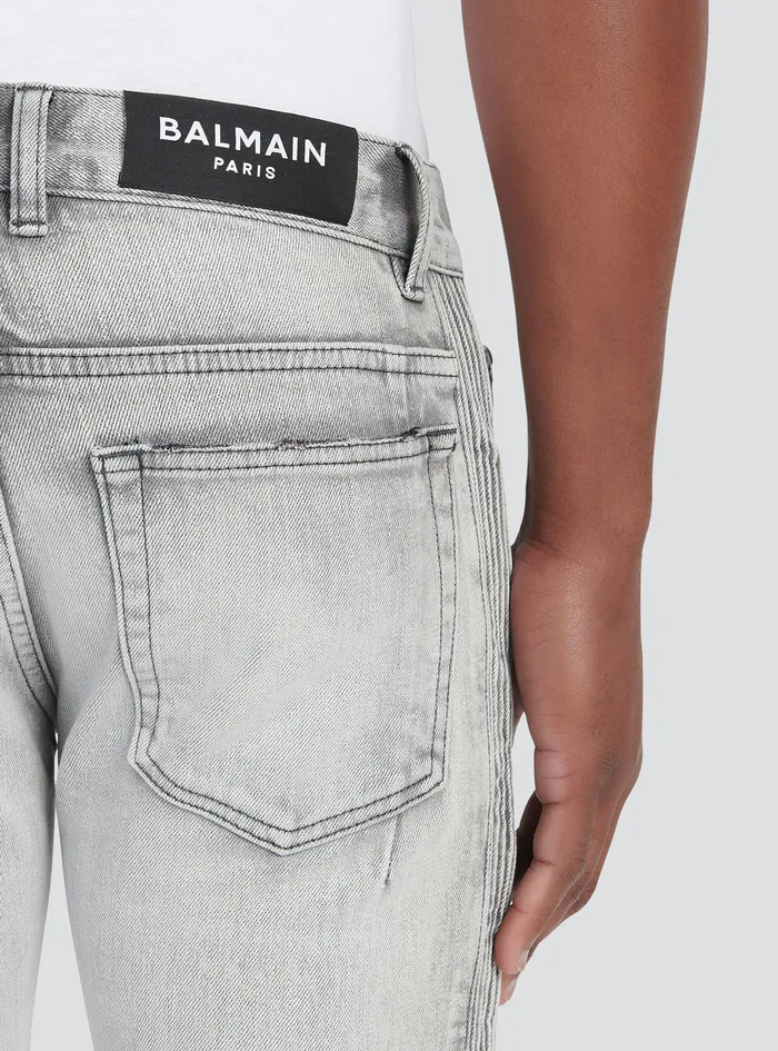 Balmain Denim Mens Slim Cut Faded And Ridged Light Gray Cotton Jeans With Balmain Monogram On Hem Grey Balmain Denim Mens Slim Cut Faded And Ridged Light Gray Cotton Jeans With Balmain Monogram On Hem Grey