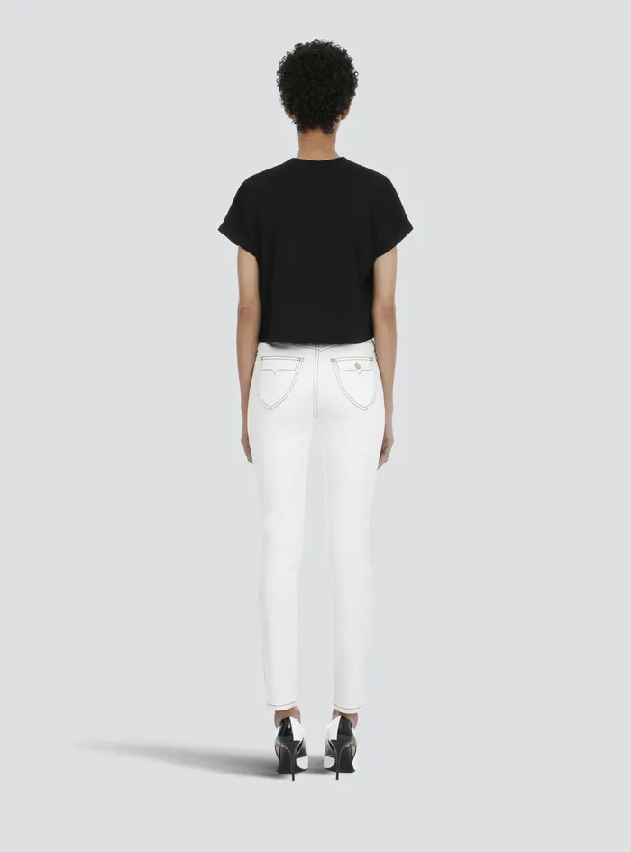 Balmain TShirts Womens Cropped EcoDesigned Cotton TShirt With Small Flocked Balmain Logo Black Balmain TShirts Womens Cropped EcoDesigned Cotton TShirt With Small Flocked Balmain Logo Black