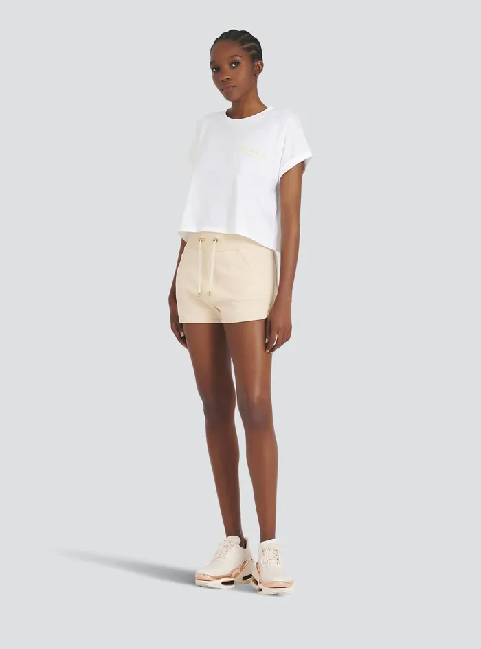 Balmain TShirts Womens Exclusive 8211 Cropped Cotton TShirt With Small Balmain Paris Logo White Balmain TShirts Womens Exclusive 8211 Cropped Cotton TShirt With Small Balmain Paris Logo White