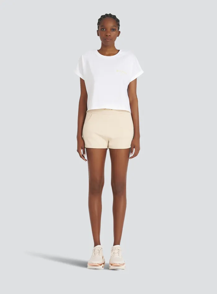Balmain TShirts Womens Exclusive 8211 Cropped Cotton TShirt With Small Balmain Paris Logo White Balmain TShirts Womens Exclusive 8211 Cropped Cotton TShirt With Small Balmain Paris Logo White