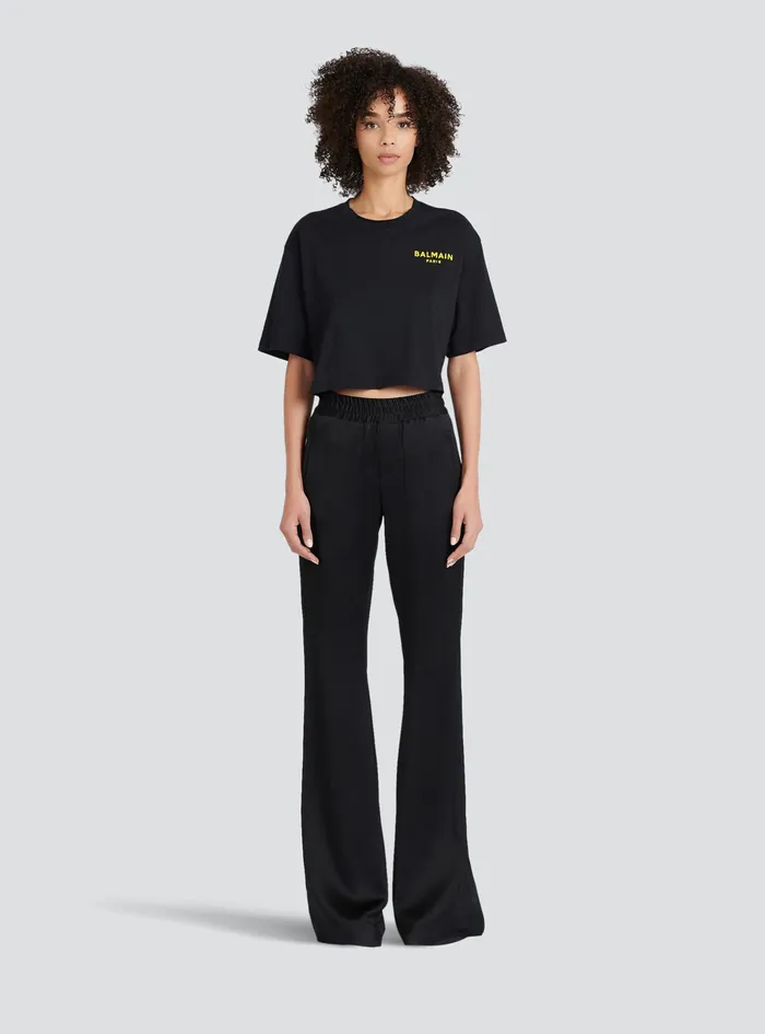 Balmain TShirts Womens X Netflix Cotton Cropped TShirt With Small Balmain Logo Print Black Balmain TShirts Womens X Netflix Cotton Cropped TShirt With Small Balmain Logo Print Black