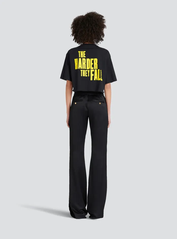 Balmain TShirts Womens X Netflix Cotton Cropped TShirt With Small Balmain Logo Print Black Balmain TShirts Womens X Netflix Cotton Cropped TShirt With Small Balmain Logo Print Black