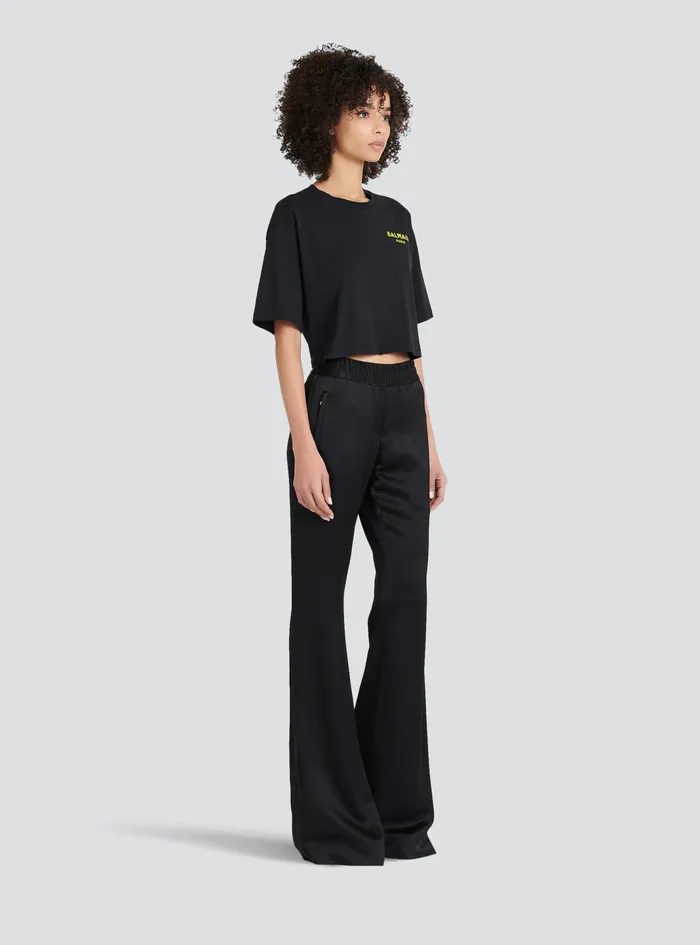 Balmain TShirts Womens X Netflix Cotton Cropped TShirt With Small Balmain Logo Print Black Balmain TShirts Womens X Netflix Cotton Cropped TShirt With Small Balmain Logo Print Black