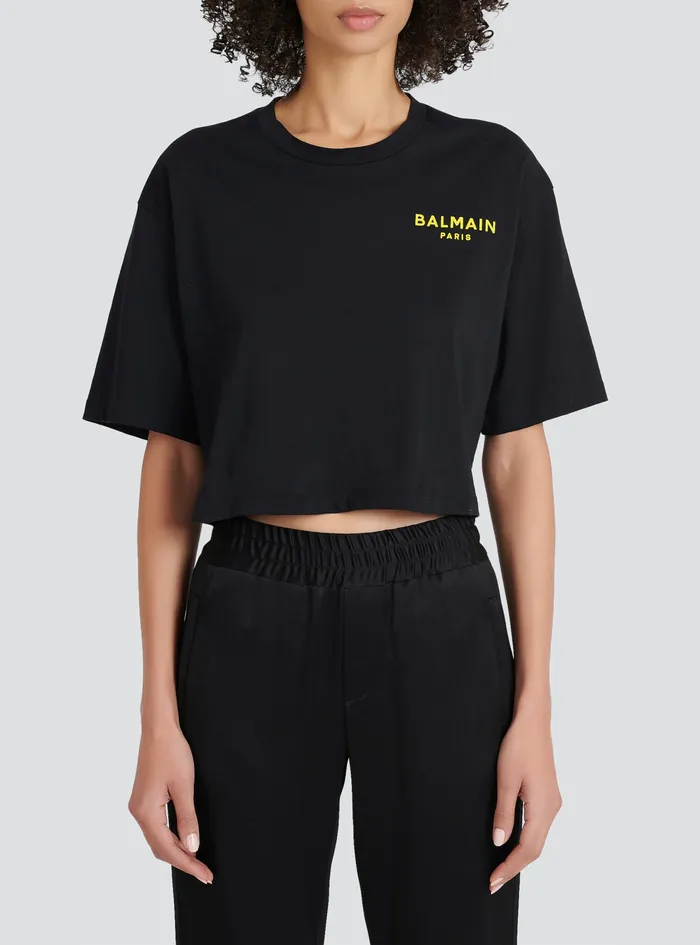 Balmain TShirts Womens X Netflix Cotton Cropped TShirt With Small Balmain Logo Print Black Balmain TShirts Womens X Netflix Cotton Cropped TShirt With Small Balmain Logo Print Black