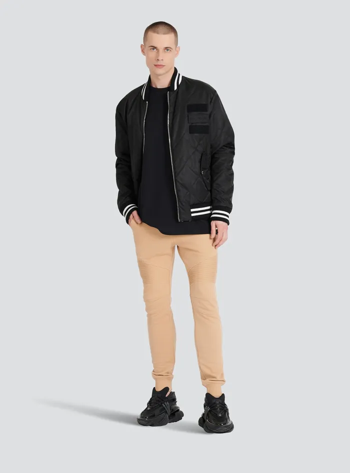 Balmain Trousers And Shorts Mens EcoDesigned Cotton Sweatpants With Black Balmain Logo Print Beige Balmain Trousers And Shorts Mens EcoDesigned Cotton Sweatpants With Black Balmain Logo Print Beige