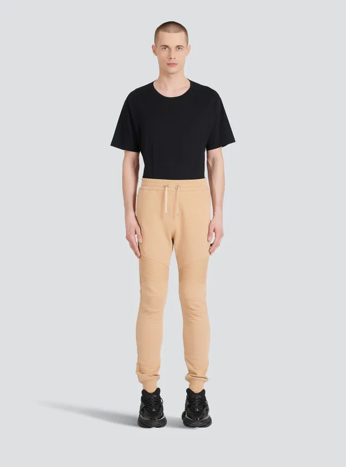 Balmain Trousers And Shorts Mens EcoDesigned Cotton Sweatpants With Black Balmain Logo Print Beige Balmain Trousers And Shorts Mens EcoDesigned Cotton Sweatpants With Black Balmain Logo Print Beige