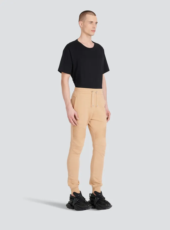 Balmain Trousers And Shorts Mens EcoDesigned Cotton Sweatpants With Black Balmain Logo Print Beige Balmain Trousers And Shorts Mens EcoDesigned Cotton Sweatpants With Black Balmain Logo Print Beige