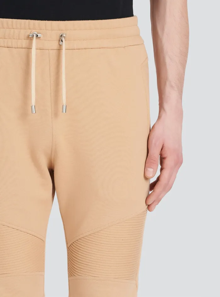 Balmain Trousers And Shorts Mens EcoDesigned Cotton Sweatpants With Black Balmain Logo Print Beige Balmain Trousers And Shorts Mens EcoDesigned Cotton Sweatpants With Black Balmain Logo Print Beige