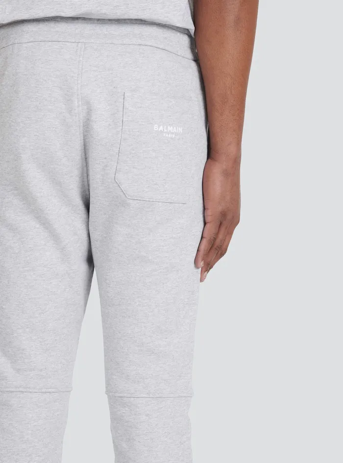 Balmain Trousers And Shorts Mens EcoDesigned Cotton Sweatpants With Flocked Balmain Paris Logo Grey Balmain Trousers And Shorts Mens EcoDesigned Cotton Sweatpants With Flocked Balmain Paris Logo Grey