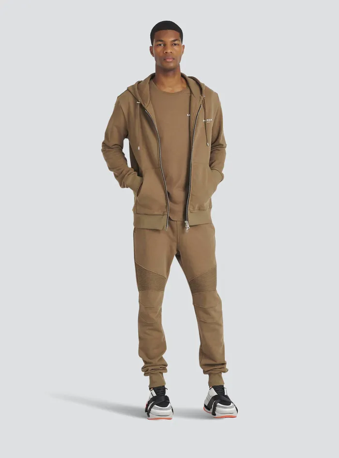 Balmain Trousers And Shorts Mens EcoDesigned Cotton Sweatpants With Flocked White Balmain Logo Brown Balmain Trousers And Shorts Mens EcoDesigned Cotton Sweatpants With Flocked White Balmain Logo Brown