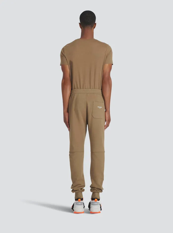 Balmain Trousers And Shorts Mens EcoDesigned Cotton Sweatpants With Flocked White Balmain Logo Brown Balmain Trousers And Shorts Mens EcoDesigned Cotton Sweatpants With Flocked White Balmain Logo Brown